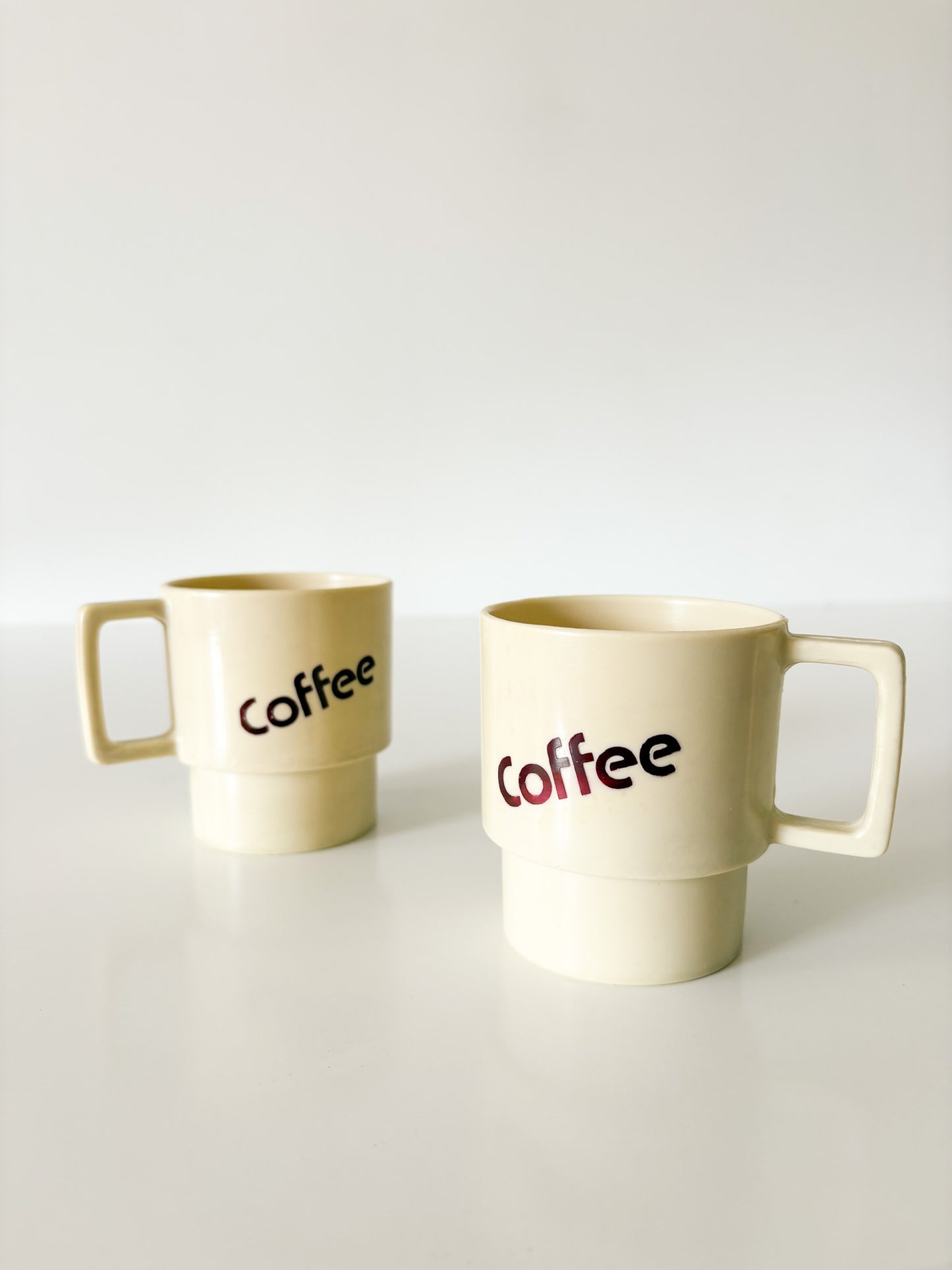 MCM Plastic Coffee Mugs, set of 2.