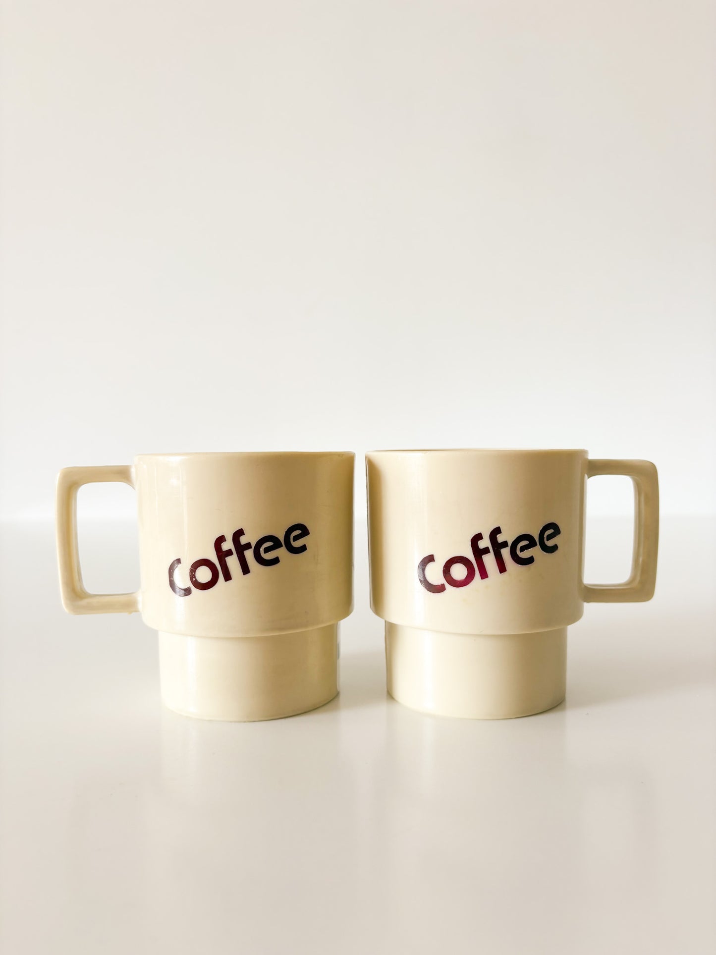 MCM Plastic Coffee Mugs, set of 2.
